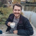 Man enjoying coffee outdoors, living with keratoconus