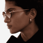 Woman wearing Cartier eyeglasses, showcasing luxury frames available in NYC.